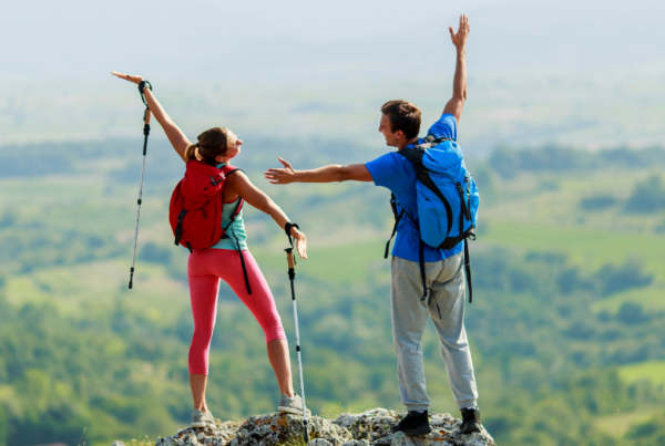 couple hiking to summit